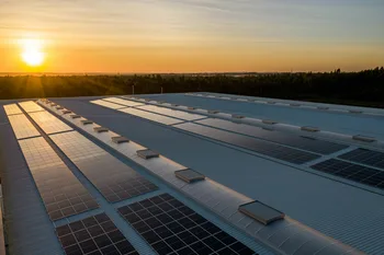 Rooftop solar panel installation at sunset