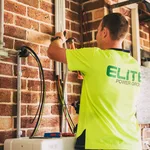 Technician installing a home solar battery system